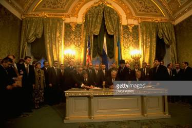 Translating for Presidents Yeltsin, Clinton and Kuchma at the signing of the treaty on the denuclearisation of Ukraine, Moscow 1994 (also in picture Russian Prime Minister Viktor Chernomyrdin, Foreign Minister Andrei Kozyrev, Defence Minister Pavel Grachev, US Secretary of State Warren Christopher)