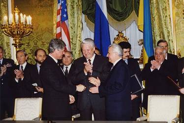 Translating for Presidents Yeltsin, Clinton and Kuchma at the signing of the treaty on the denuclearisation of Ukraine, Moscow 1994 (also in picture Russian Prime Minister Viktor Chernomyrdin, Foreign Minister Andrei Kozyrev, Defence Minister Pavel Grachev, US Secretary of State Warren Christopher)