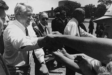 Translating for President Yeltsin on a visit to Wichita, Kansas, 1993 (also in picture, Senator Bob Dole)